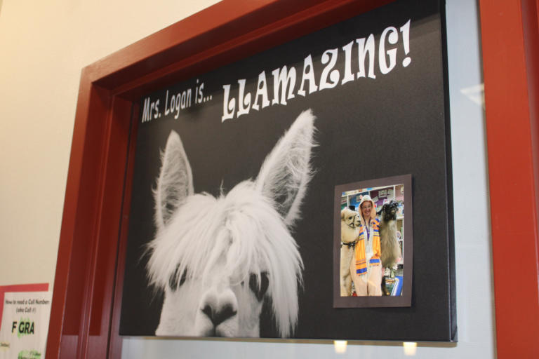 A poster inside the Dorothy Fox Elementary School library in Camas on Monday, March 4, 2024, celebrates teacher-librarian Sarah Logan, who once brought llamas to the school for a class project.