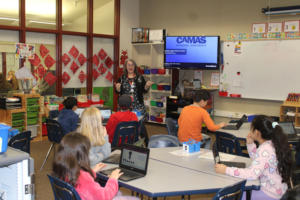 Dorothy Fox Elementary School’s teacher-librarian, Sarah Logan, teaches students about research methods and biographies inside the Camas school’s library, Monday, March 4, 2024. (Photos by Kelly Moyer/Post-Record)