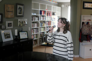 Jemtegaard Middle School seventh-grader Emily Lampmann sings at a Washougal residence, Friday, March 1, 2024.