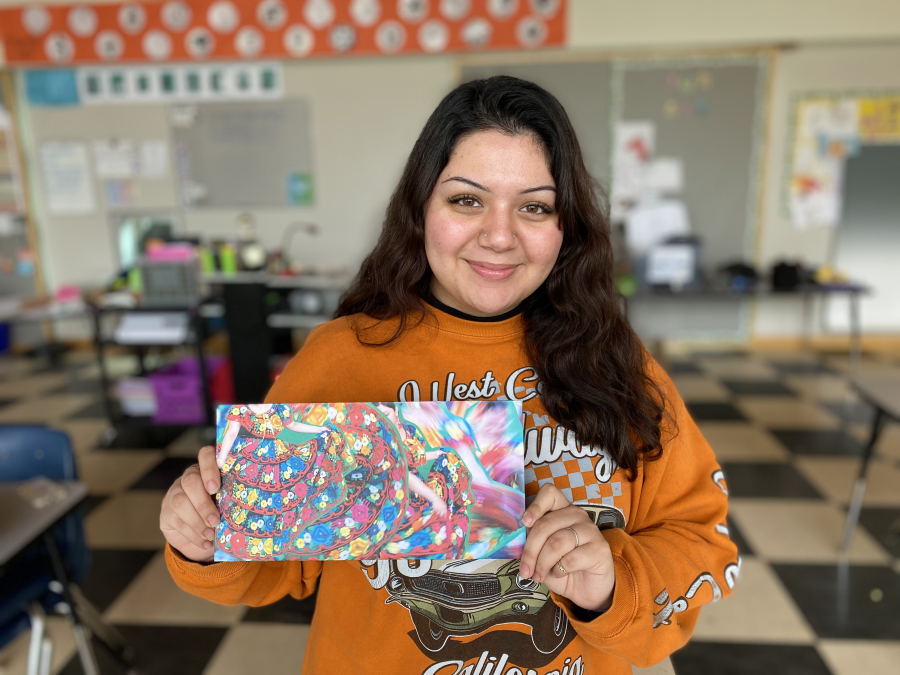 Hayes Freedom High School senior Maria Navarro Alejandres shows her artwork (Contributed photo by Miranda Wakeman, courtesy of Maria Navarro Alejandres