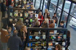 Crowds peruse artwork during the 2023 Little Art Camas event in downtown Camas,, in March 2023. (Photo courtesy of Downtown Camas Association) 