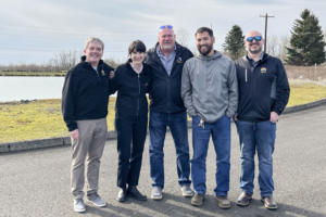 Congresswoman Marie Gluesenkamp Perez (second from left) stands gathers with Washougal employees, including City Manager David Scott (far left) and Mayor David Stuebe (center), at the City’s wastewater treatment plant in 2023. (Contributed photo courtesy of Marie Gluesenkamp Perez)