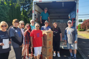 Volunteers from Impact Camas-Washougal at St. Matthew Lutheran Church collect deliveries for low-income families in 2023. The Impact Camas-Washougal program is a 2024 Camas-Washougal Community Chest grant recipient and will use the money to buy food and grocery gift cards for families in need in the Camas and Washougal school districts. (Contributed photo courtesy of the Camas-Washougal Community Chest) 