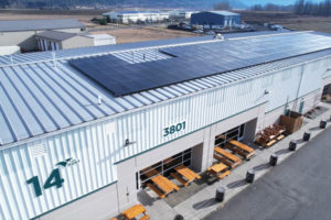 Clark Public Utilities installed solar panels on the roofs of five buildings, including Building 14 (above), at the Port of Camas-Washougal’s industrial park in late 2023 and early 2024. (Contributed photo courtesy Port of Camas-Washougal)