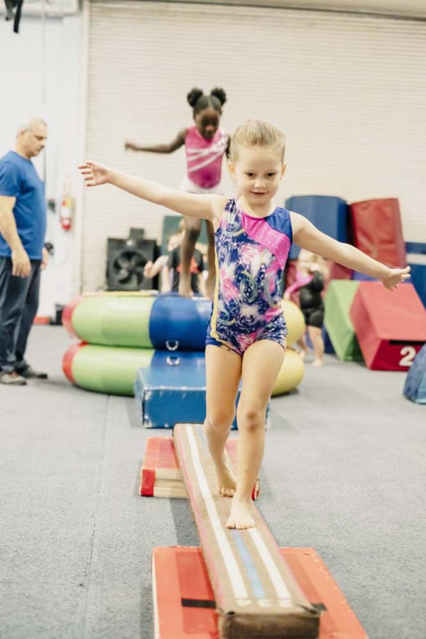 A student walks on a beam during a Vancouver Elite Gymnastics Academy class in an undated photo. (Contributed photo courtesy Vancouver Elite Gymnastics Academy)