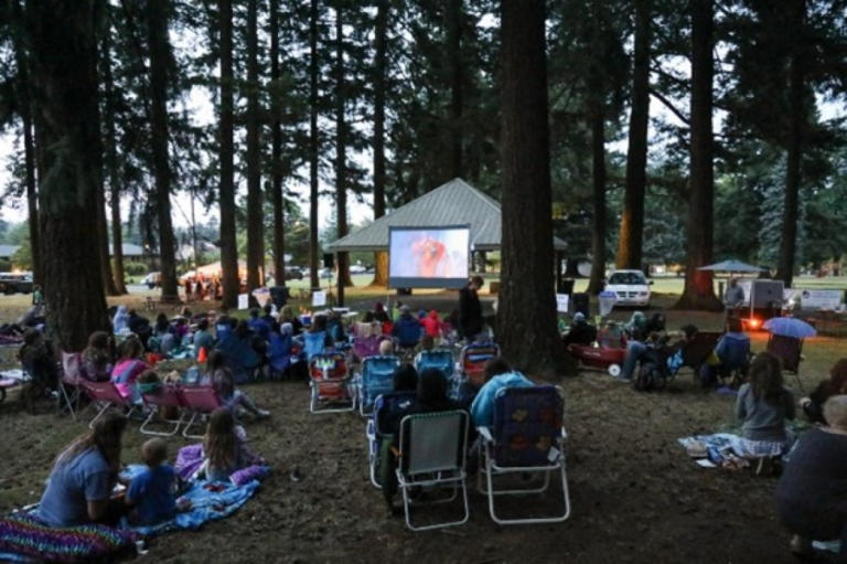 People gather at Camas' Crown Park for a past "Movies in the Park" event.