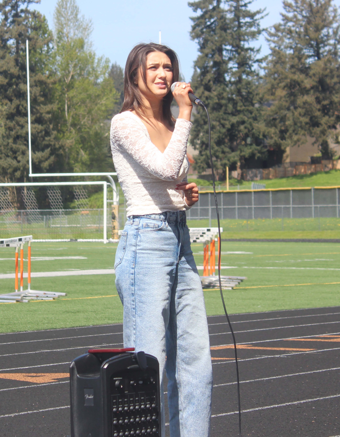 Washougal High School student Morgan Greco speaks during a student walkout at Fishback Stadium to protest Washougal School District&rsquo;s proposed budget cuts, April 10, 2024.