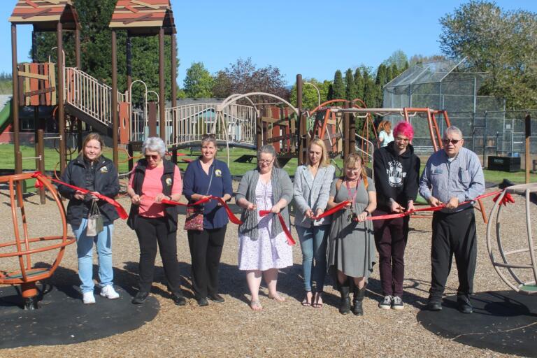Washougal officials, Parks Commission members, city staff and the coordinator of the Clark County Community Development Block Grant program attend a ribbon-cutting for the Hamllik Park playground on April 18, 2024.