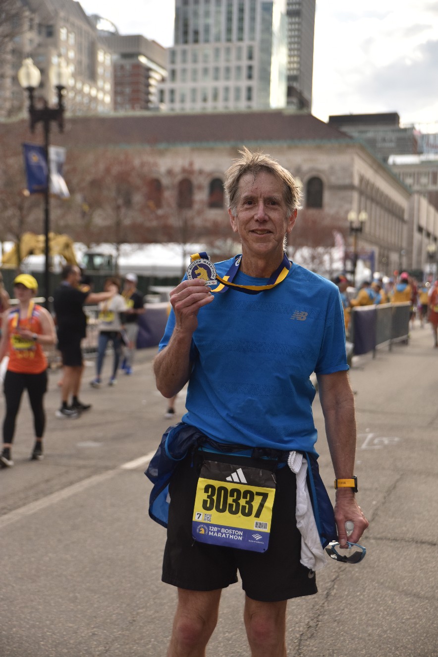 Camas resident Gary Abrahamsen holds a  medal that he received for finishing the Boston Marathon on April 15, 2024. (Photo courtesy of Gary Abrahamsen)