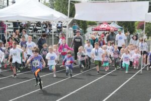 Children run from the starting line during the 2023 Student Stride for Education event in Washougal. (Contributed photo courtesy of Greg Brown)