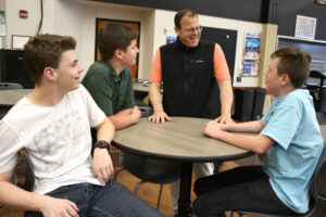 Washougal High School  Principal Aaron Hansen chats with students in May 2019. In April 2024, the Washougal School Board announced Hansen would be the district’s 2024-25 interim superintendent. (Contributed photo courtesy Washougal School District)