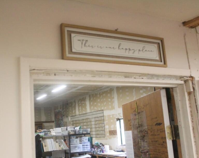 Doug Flanagan/Post-Record 
 A sign that reads, &quot;This is our happy place&quot; hangs above the doorway leading into the Adret Artist Collective&#039;s shared studio in Washougal.