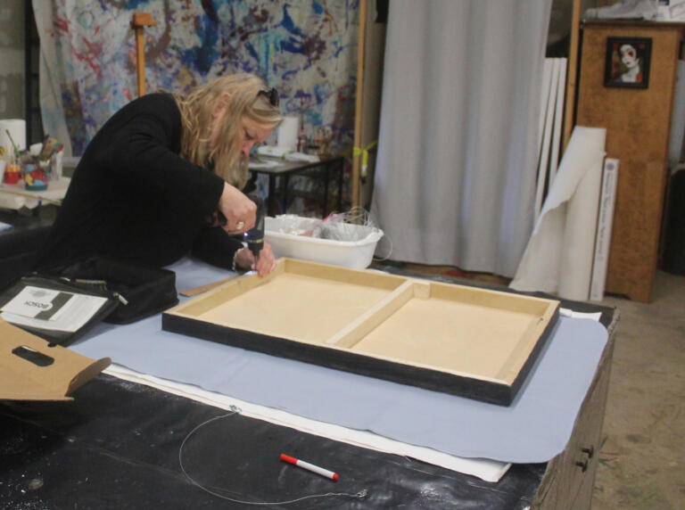 Doug Flanagan/Post-Record 
 Adret Artist Collective member Ellen Nordgren attaches a screw to the frame of one of her piecese at the Collective&#039;s shared studio in Washougal on May 2.