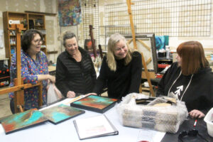 Adret Artist Collective members, from left to right, Regina Westmoreland, Judi Clark, Ellen Nordgren and Elizabeth Dye talk about their art at the Collective’s shared studio space in Washougal on May 2, 2024. (Doug Flanagan/Post-Record)