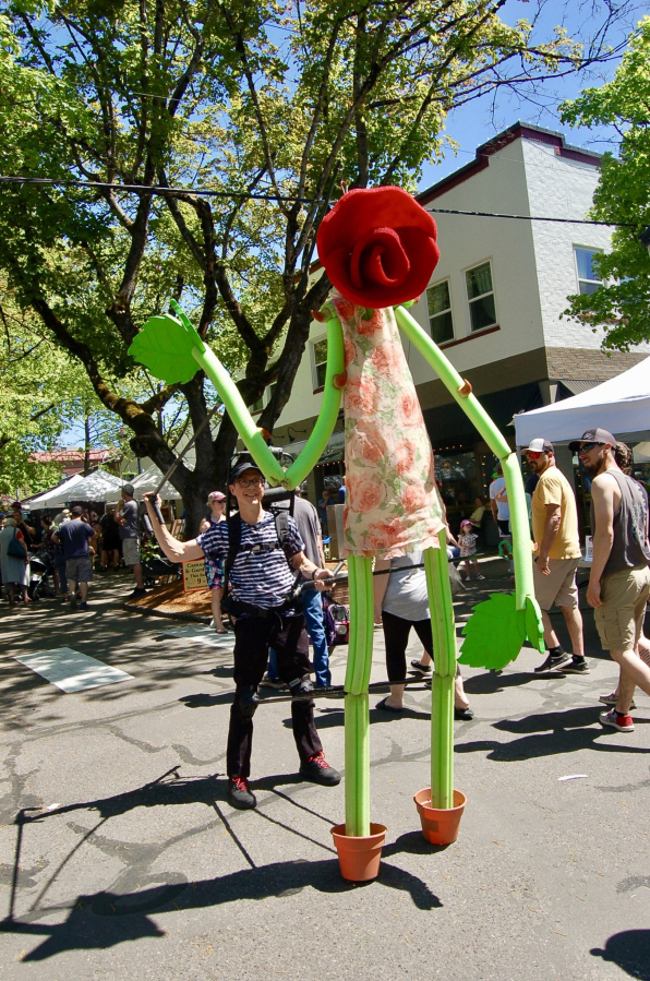 A flower "walks" through downtown Camas during the 2023 Camas Plant & Garden Fair.