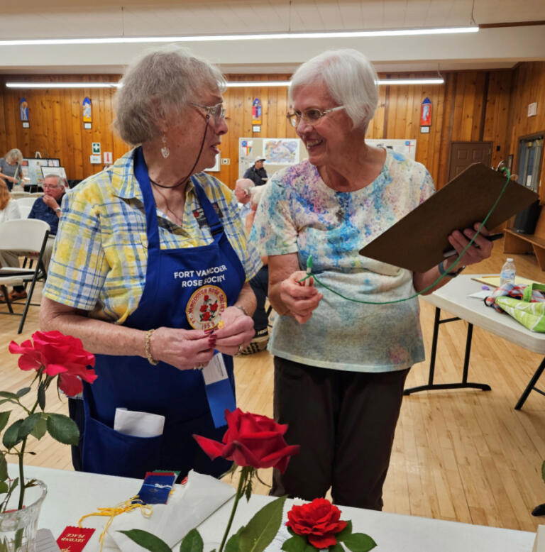 Volunteers from the Fort Vancouver Rose Society attend the 2023 Camas Plant & Garden Fair.