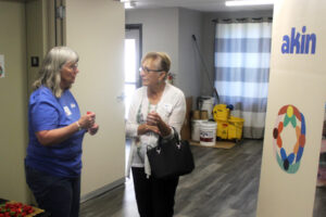Akin employee Beverly Skoda (left) greets a visitor at the East County Family Resource Center in Washougal during an open house event held May 9, 2024. (Doug Flanagan/Post-Record)