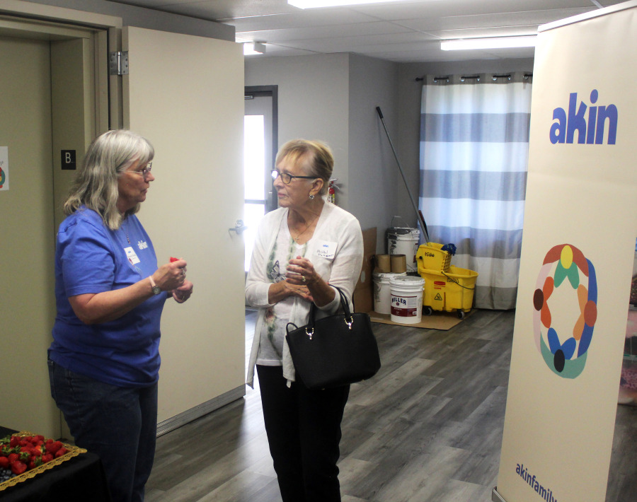 Akin employee Beverly Skoda (left) greets a visitor at the East County Family Resource Center in Washougal during an open house event held May 9, 2024. (Doug Flanagan/Post-Record)