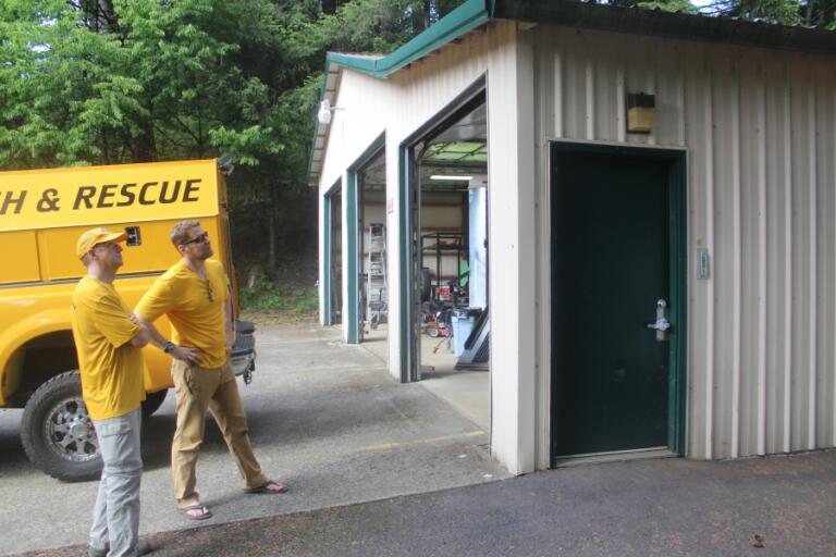 Doug Flanagan/Post-Record   Silver Star Search and rescue medical officer Jeff Berner (right) and board member Tom Nichols look at the front of East County Fire and Rescue&#039;s Station 92 on May 13.