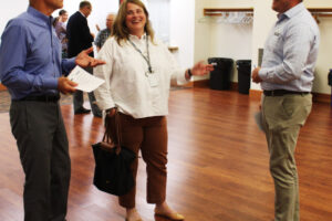 Camas School Board member Erika Cox (center) gathers with Camas School Board members Doug Quinn (left) and Corey McEnry during the 2022 State of the Community event at Lacamas Lake Lodge in Camas, Thursday, Sept. 15, 2022. (Kelly Moyer/Post-Record files)