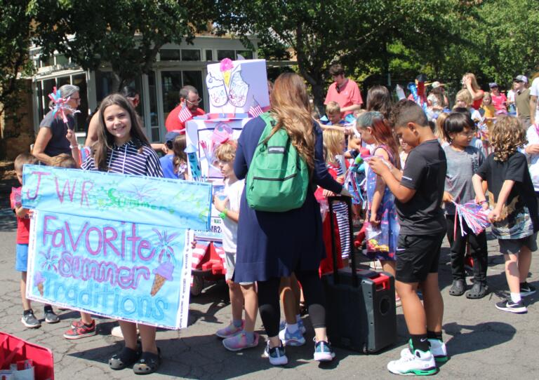Students from the Jack, Will and Rob Center summer care program wait for the start of the 2024 "America the Beautiful" themed Camas Days Kids Parade near the Camas Public Library, Friday, July 26, 2024. (Kelly Moyer/Post-Record)