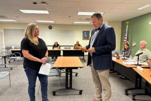 Washougal School District's interim superintendent, Aaron Hansen (right), swears in the Washougal School Board's newest member, Jane Long (left) during the Board's meeting on Tuesday, Sept. 10, 2024. (Contributed photo courtesy of the Washougal School District)