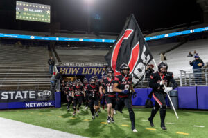 The Camas Papermakers enter the field Saturday, Dec. 7, 2024, ahead of a game against Sumner in the 4A State Championship game at Husky Stadium. (Taylor Balkom/The Columbian)