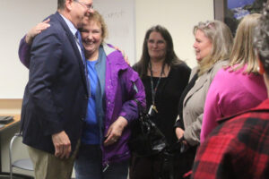 Aaron Hansen (left) is greeted by family members, friends and colleagues after being named the Washougal School District’s interim superintendent, April 30, 2024. (Doug Flanagan/Post-Record)
