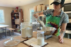 Kendra Hofseth, owner of Bakehouse Sourdough, creates a new batch of slow-fermented sourdough bread inside her Washougal home-based microbakery in an undated photo. (Contributed photo courtesy of Kendra Hofseth)