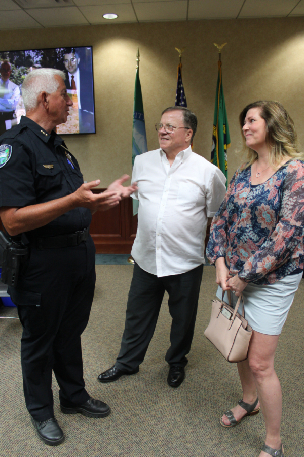 Kelly Moyer/Post-Record files 
 Camas City Councilwoman Bonnie Carter (right), Camas Mayor Steve Hogan (center) and Camas Police Chief Mitch Lackey (left) talk during Lackey&#039;s retirement party at Camas City Hall, on June 30, 2023.