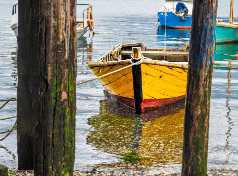 Photographer Leslie Struxness captured this image of a yellow wooden boat off Chiloe Island in Chile. Struxness&rsquo; photos can be viewed through January at the Second Story Gallery in Camas.