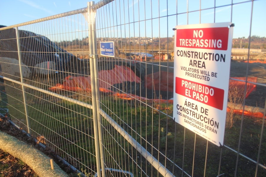 Doug Flanagan/Post-Record 
 A sign is attached to a fence on the east side of the Hyas Point waterfront development construction site on Jan. 15, 2025.