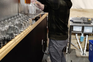 Recluse Brew Works employee Andrew Bradford pulls a pint of Entonces, a Vienna-style lager, at the Washougal taproom on Saturday, Jan. 11, 2025. (Doug Flanagan/Post-Record)