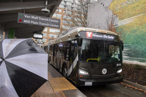 A C-Tran Red Vine bus pulls in to pick up passengers at Turtle Place Station in downtown Vancouver on Friday morning, Dec. 22, 2023. (Amanda Cowan/The Columbian)