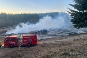 East County Fire and Rescue fire crews survey the aftermath of an early morning fire that destroyed a home under construction on Northeast Livingston Mountain Circle in Camas on Sunday, Jan. 26, 2025. (Contributed photo courtesy of East County Fire and Rescue) 