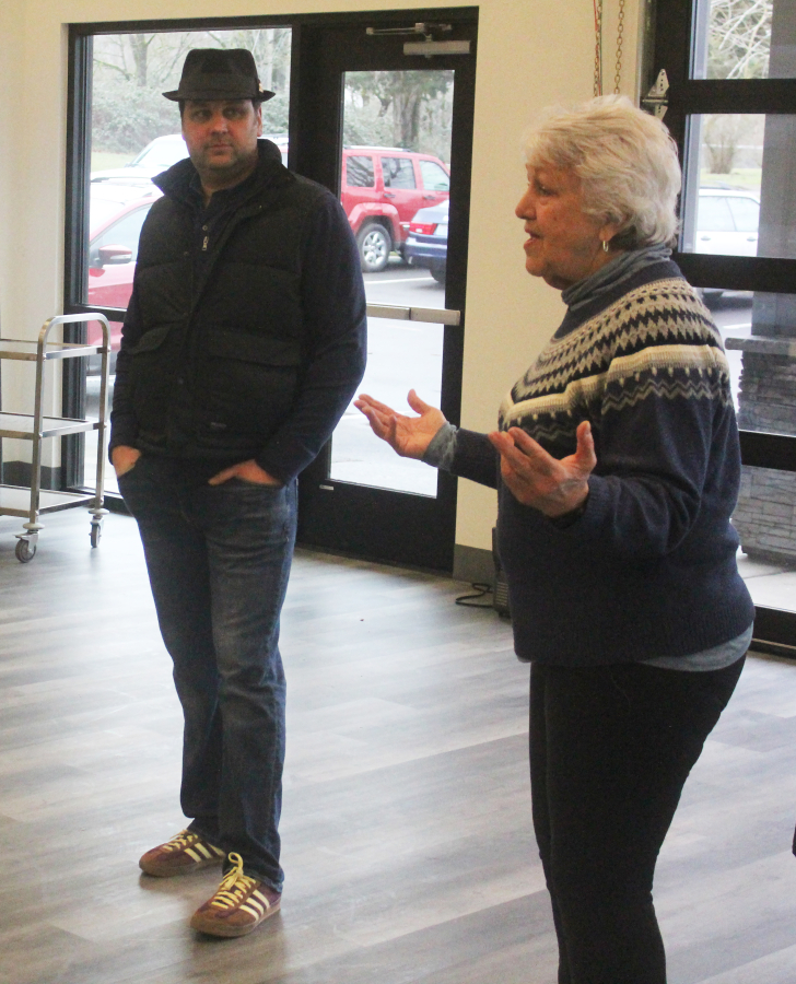 Washougal Councilwoman Molly Coston, right, speaks while Jason Van Aalsburg, the city of Washougal&rsquo;s public works senior analyst, listens during a celebration event at the Washougal Community Center on Feb. 18.