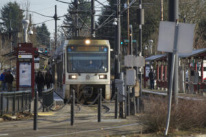 A MAX light rail train approaches the Kenton/North Denver stop in Portland. (The Columbian files)