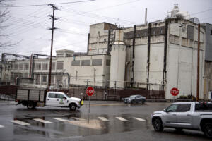 Motorists pass by the Georgia-Pacific mill in Camas on Monday morning. (Amanda Cowan/The Columbian)