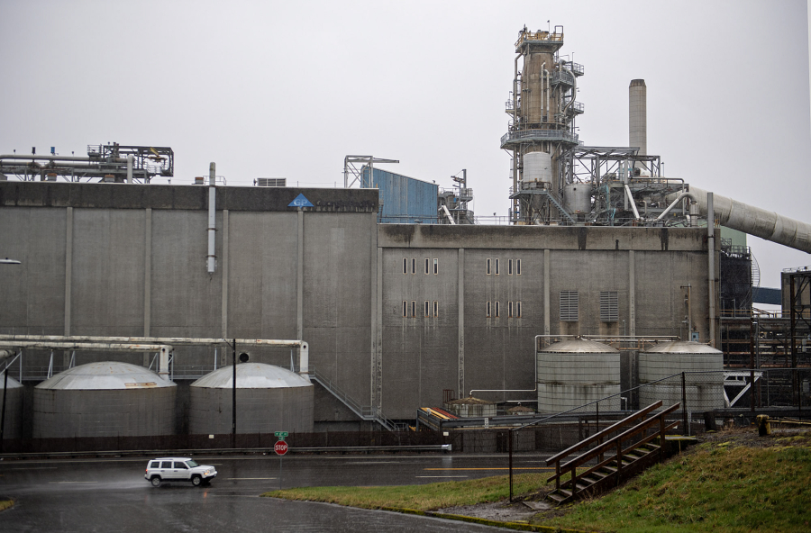 A motorist passes by the Georgia-Pacific mill in downtown Camas on Monday morning. (Amanda Cowan/The Columbian)