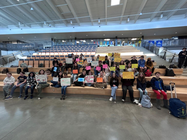Camas students from Odyssey Middle School and Discovery High School gather inside the project-based learning high school's commons area on Wednesday morning, Feb. 26, 2025, to protest a Camas School District cost-saving plan that will bring Odyssey students into the Discovery building at the start of the 2025-26 school year.