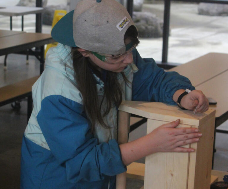 Columbia River Gorge Elementary School student Gabriella Kinnan constructs a toolbox at the school Feb.