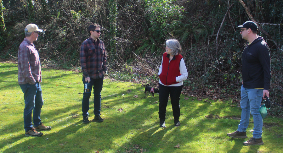 From left to right, Washougal Ivy League board members Tim Goss, Robert Lindgren, Virginia Frederick, and Alex Post talk at Lower Hathaway Park on March 8, 2025. (Doug Flanagan/Post-Record)