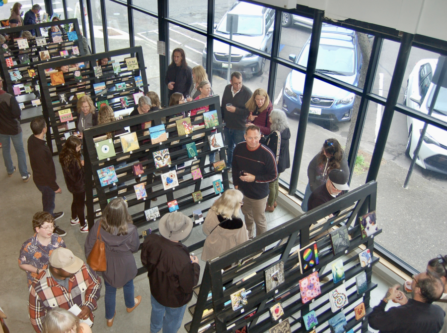 Visitors to the 2024 Little Art Camas event in Camas peruse dozens of $20 art pieces created by local artists. This year’s Little Art Camas will be held Friday and Saturday, March 21-22, at the Fuel Medical Group building in downtown Camas. At top, right, Artwork is displayed at the 2024 Little Art Camas event at Fuel Medical Group in downtown Camas in March 2024. (Photos contributed by the Downtown Camas Association)