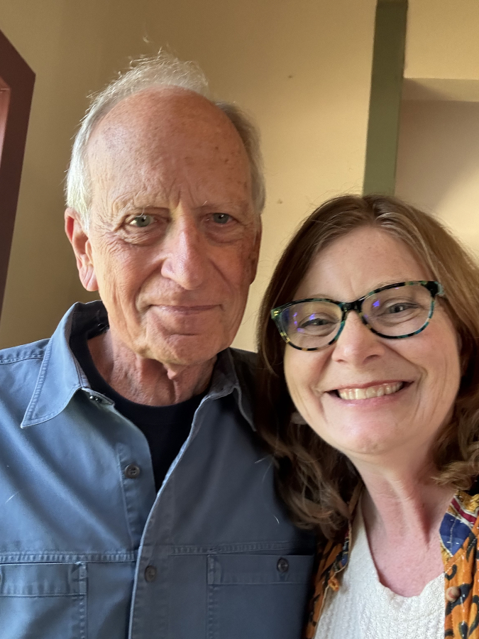 Molly McKay Williams, right, president of the Camas Earth Day Society, greets Camas native Denis Hayes, a key organizer of the first Earth Day. (Contributed by Molly Williams)