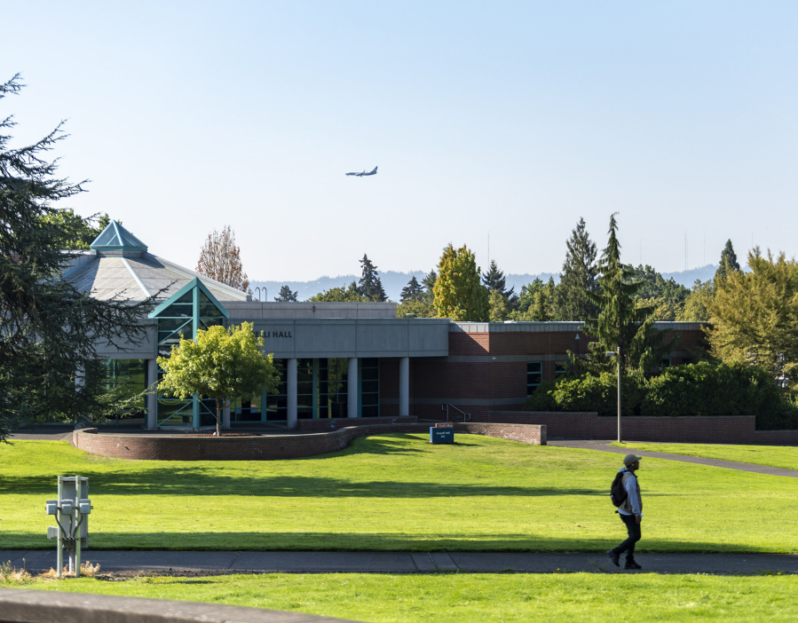 A plane flies above the Clark College campus Sept. 19, 2022, during the first day of classes. (Taylor Balkom/The Columbian files)