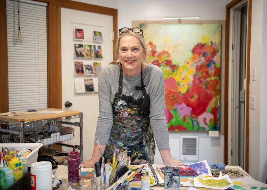 Artist Heidi Curley experienced overwhelming grief 15 years ago, when her husband, Ed, died by suicide. She said she moved “out of the darkness and into the light” using art and art journaling to help her process her emotions. (Taylor Balkom/The Columbian)