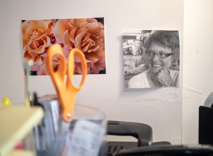 A photo of artist Heidi Curley’s mother hangs on the wall at Curley’s art studio in Camas Feb. 25, 2025. When her mother was dying, Curley asked her, “How am I going to live without you?” Her mother replied, “Be kind and tell the truth.” (Taylor Balkom/The Columbian)