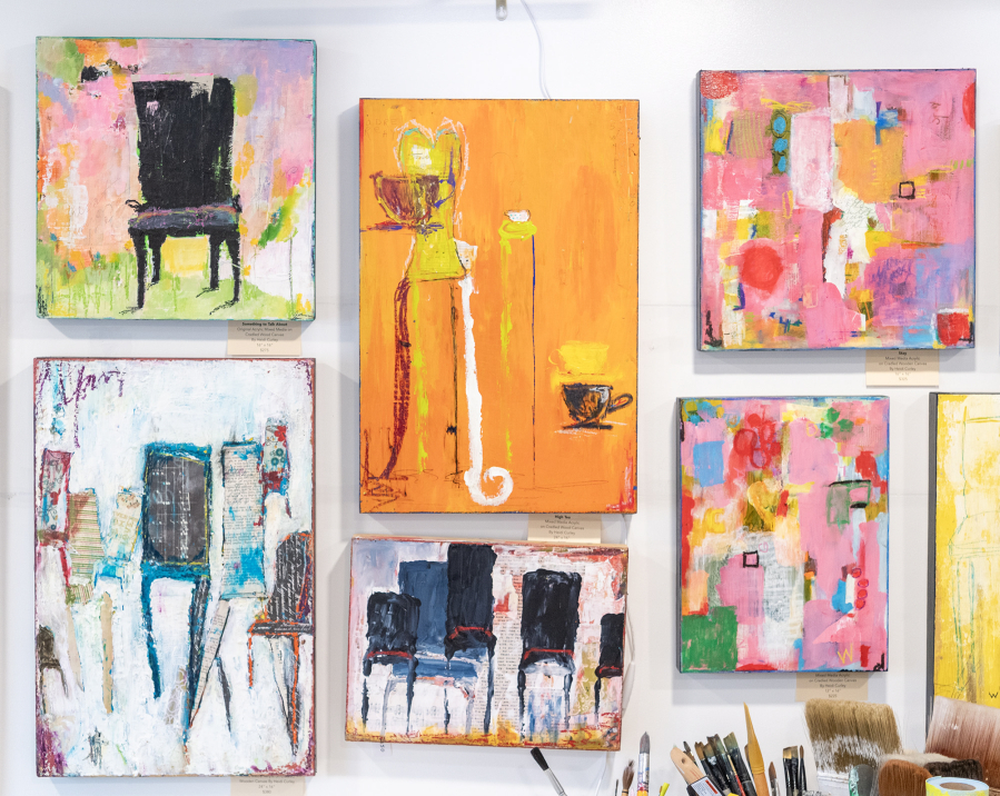 Artwork by Heidi Curley hangs on the wall of her studio in Camas, Feb. 25, 2025. Curley says the chairs represent the fact that she will always have a chair available for people in need.