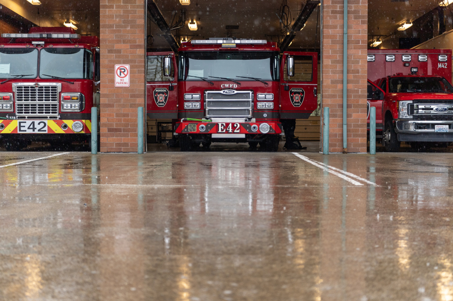 Fire trucks stay dry inside Friday at Camas-Washougal Fire Department’s Station 42. Camas and Washougal voters on April 22 will decide the fate of the proposed Camas-Washougal Regional Fire Authority. (Taylor Balkom/The Columbian)