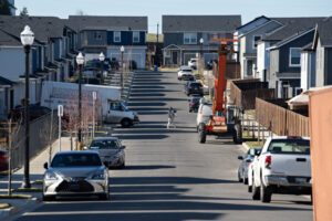 Construction equipment sits near newly built houses Jan. 27 in the North Haven development near Fairgrounds Community Park in north Clark County. The National Association of Home Builders believes tariffs will raise the cost of a single-family home in the United States by $7,500 to $10,000. (Photos by Amanda Cowan/The Columbian files)